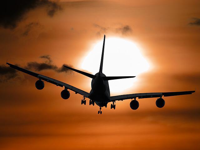 Départ avion coucher de soleil